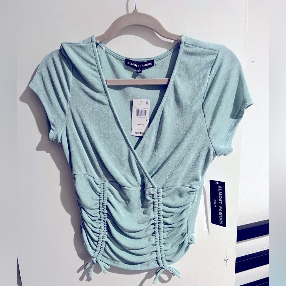 Brand new almost famous Large mint mid length crop top.